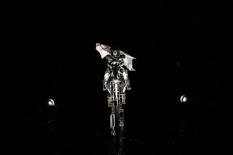 An artist performs Summer Olympic opening ceremony